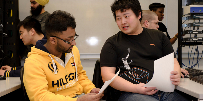 Centennial College Global Experience Office Guide with a foreign exchange student.